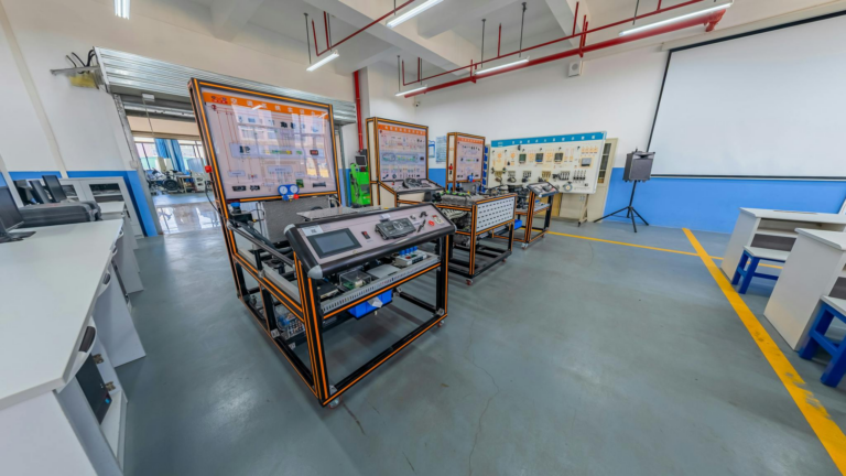 Spacious engineering laboratory equipped with advanced training systems and desks.